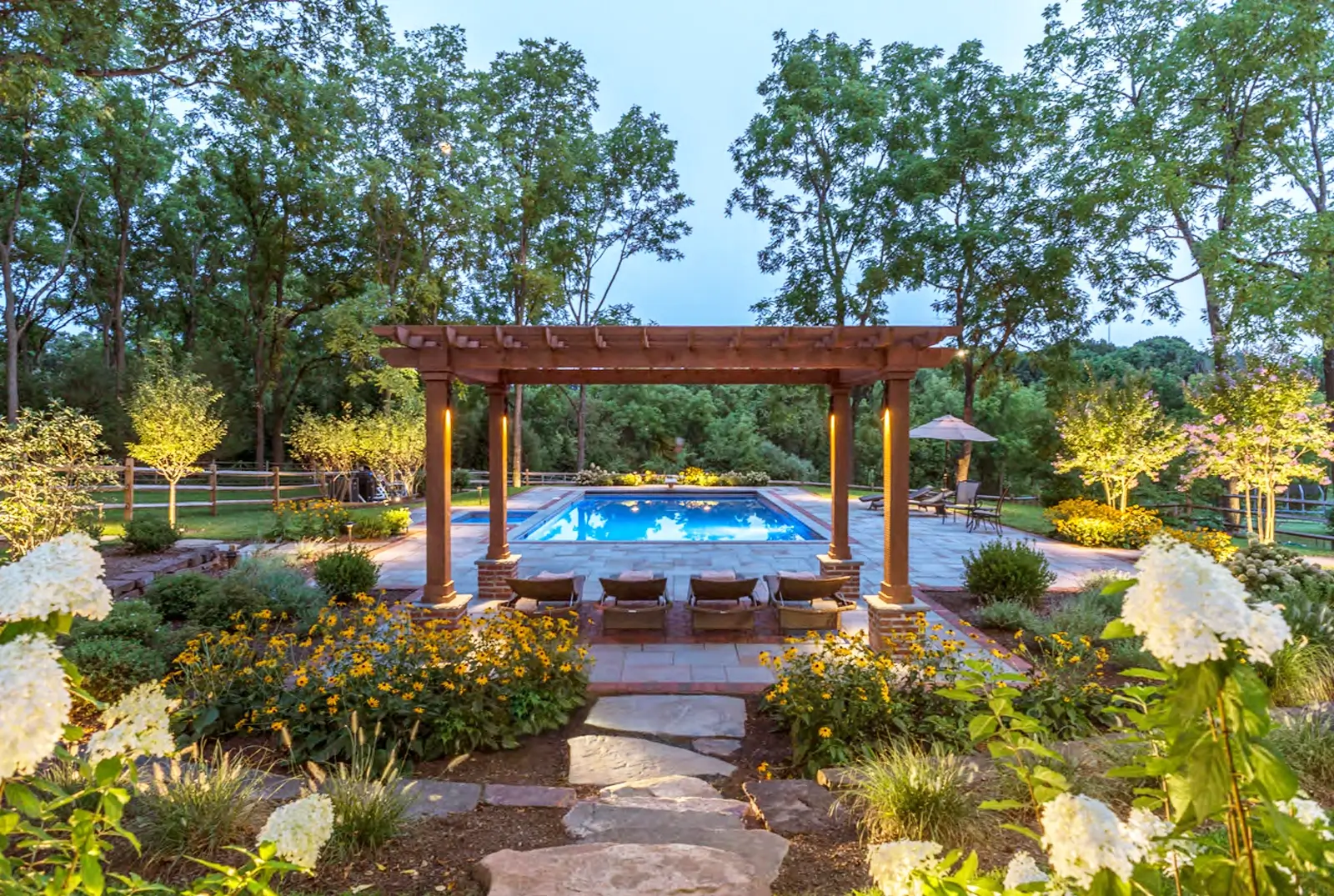 Coastal Source outdoor audio system integrated into a landscaped outdoor living space